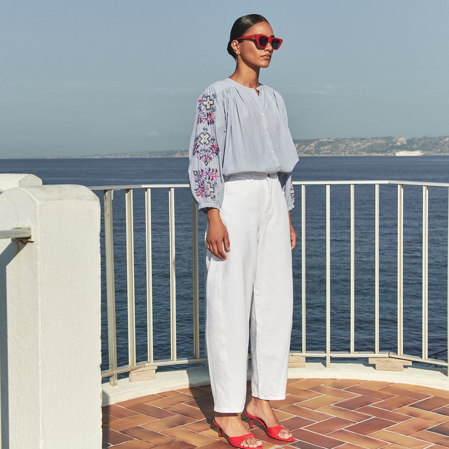 featured, aisha with blouse and white pants